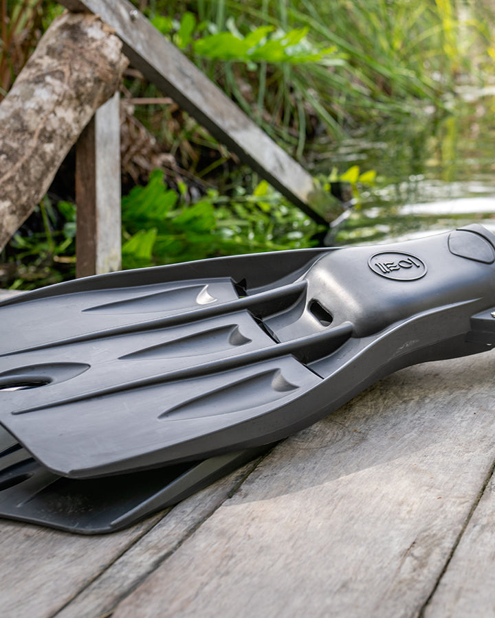 Fourth Element Tech Fins in black on a dive side entry